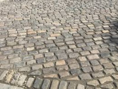 Bury Paving Contractors Laying Cobblestones in Bury