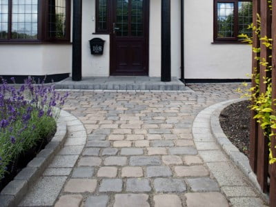 Bury Paving Contractors Laying Cobblestones in Bury