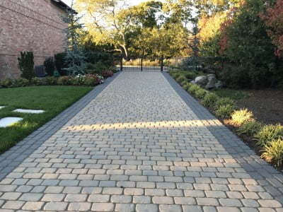 Bury Paving Contractors Laying Cobblestones in Bury